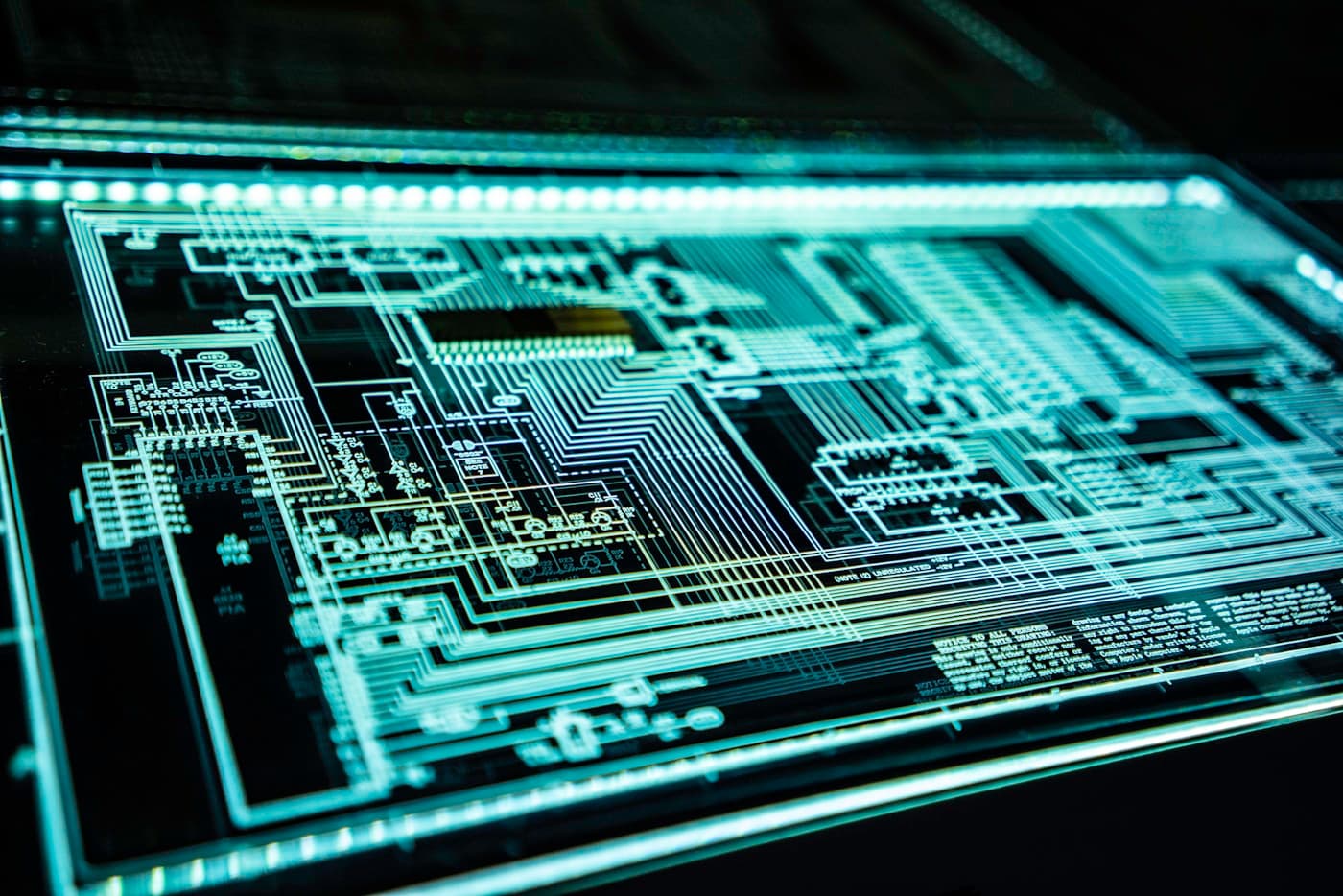 Abstract circuit board network with glowing cyan connections on dark background