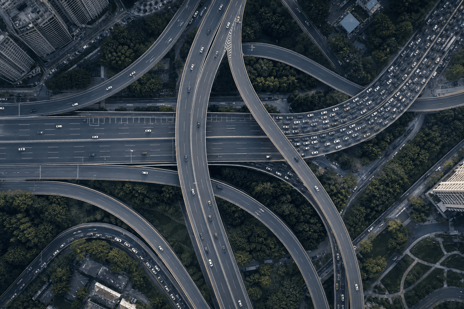 Aerial view of a highway interchange with some lanes clear and others congested